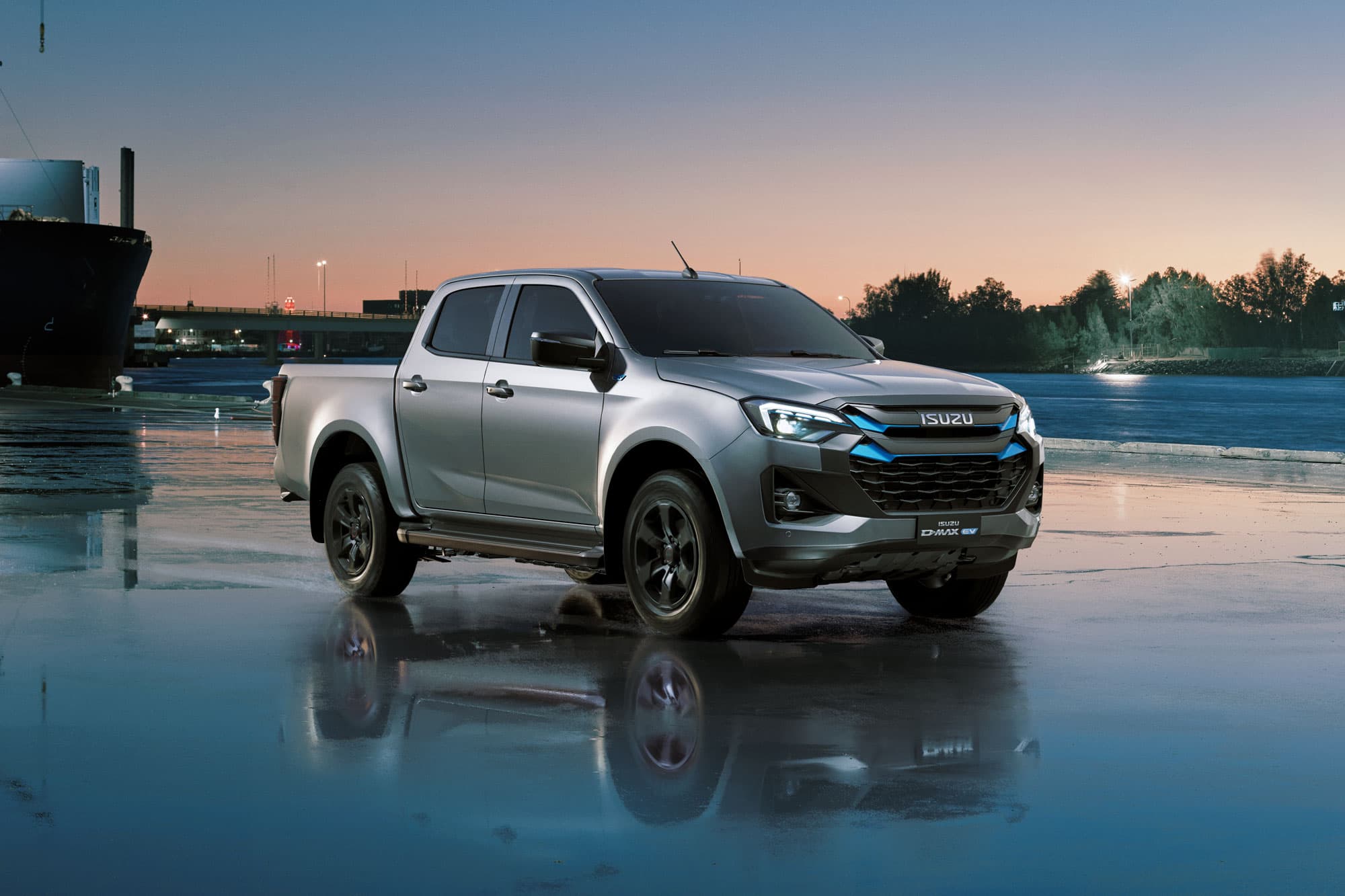 Grey Isuzu D-MAX EV Double Cab in the harbor