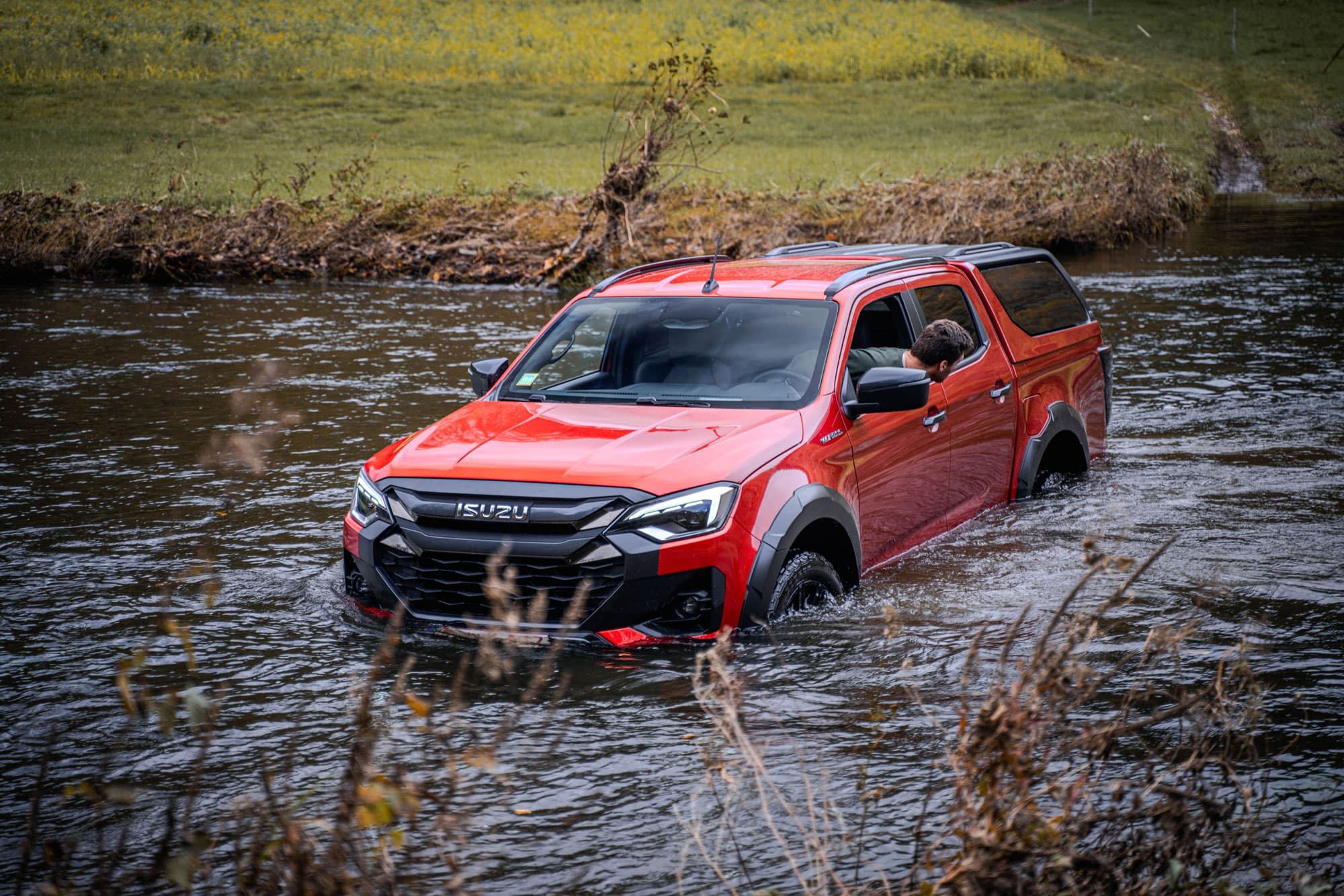 Isuzu D-Max 2024 driving through water